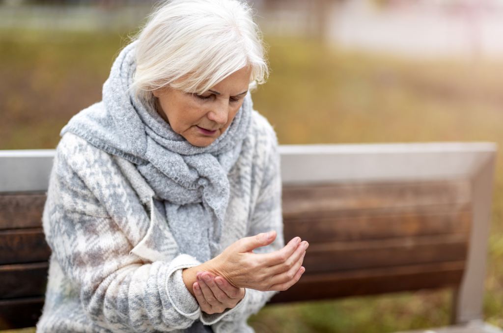 Elderly Woman Suffering With Arthritis Pain In Wrist