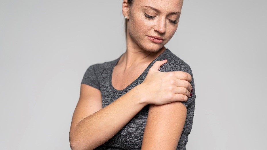 Woman With Shoulder Pain Caused By Rotator Cuff Injury