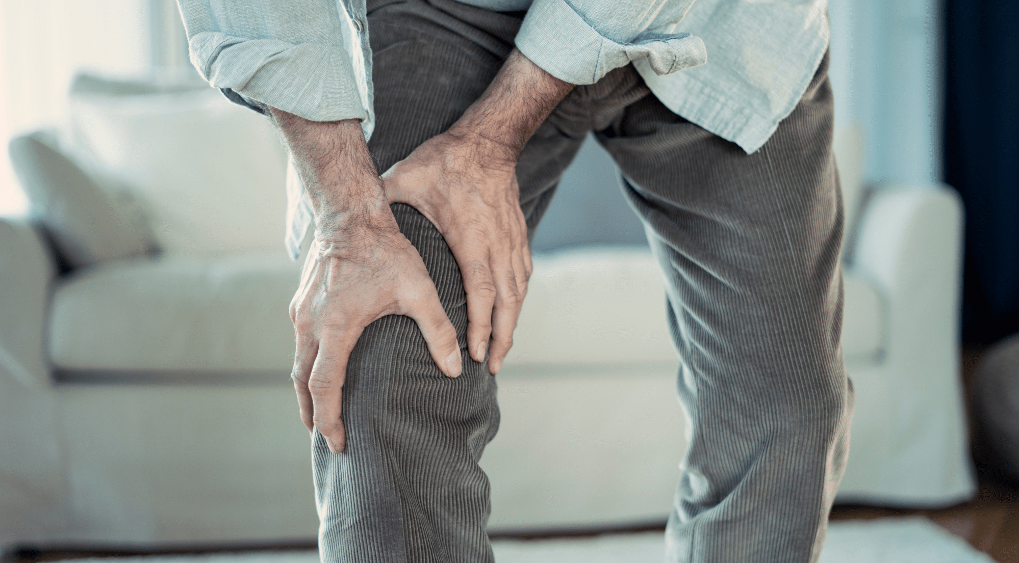 Elderly Man Who Has Knee Pain When Bending And Walking