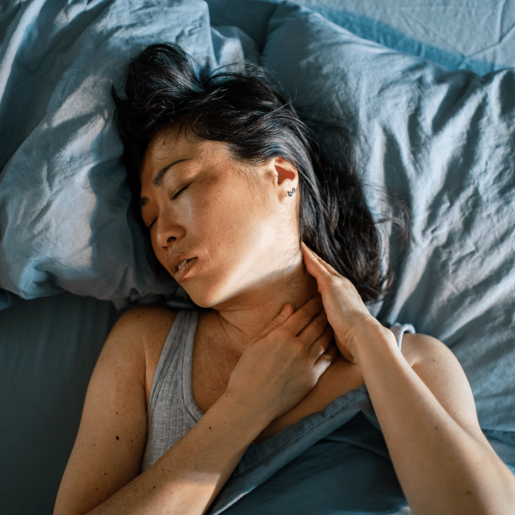 Woman Suffering With Neck Pain While Sleeping