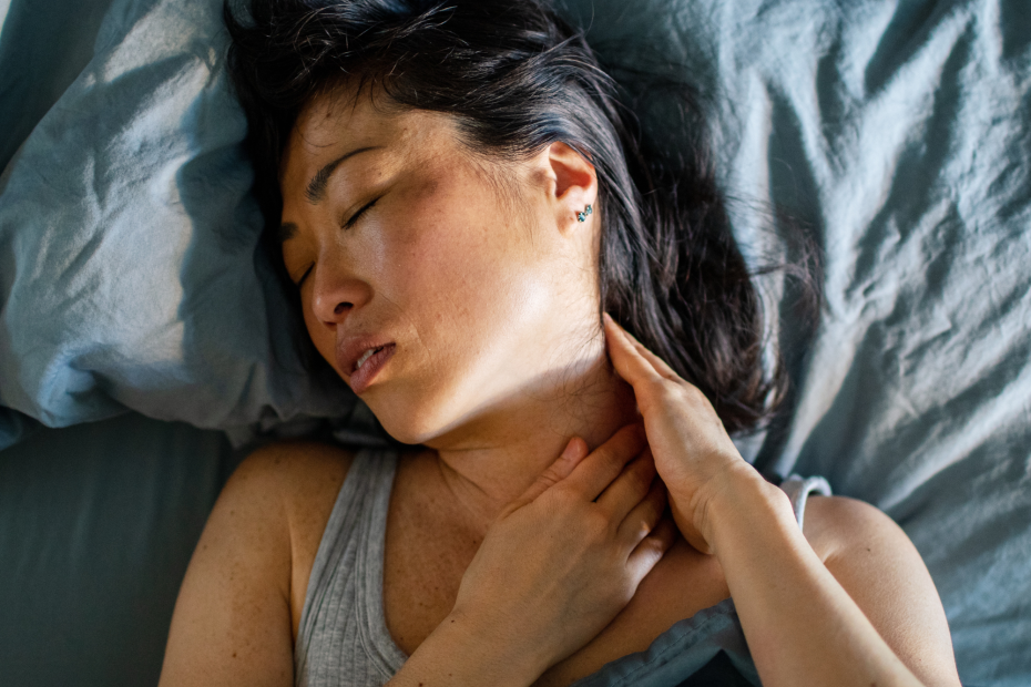 Woman Suffering With Neck Pain While Sleeping